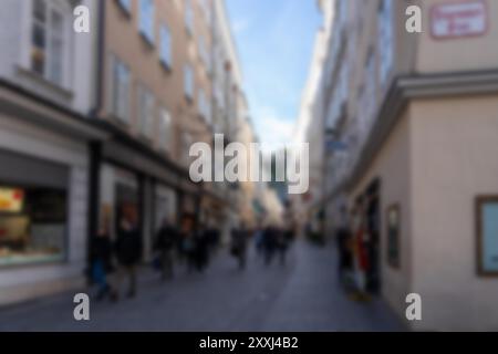 A blurred image of an alleyway in Salzburg, Austria.  The background is blurred, creating a bokeh effect. Stock Photo