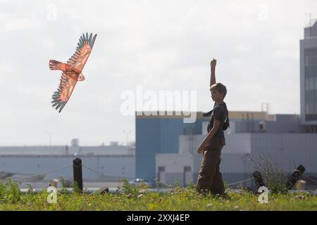 St. Petersburg, Russia. 24th Aug, 2024. A boy flies a kite during a kite festival in Kronstadt, St. Petersburg, Russia, Aug. 24, 2024. The festival was held here from Aug. 24 to 25. Credit: Irina Motina/Xinhua/Alamy Live News Stock Photo