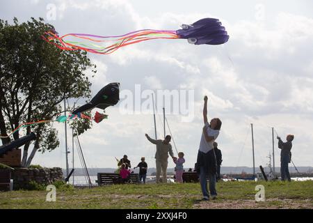 St. Petersburg, Russia. 24th Aug, 2024. People fly kites during a kite festival in Kronstadt, St. Petersburg, Russia, Aug. 24, 2024. The festival was held here from Aug. 24 to 25. Credit: Irina Motina/Xinhua/Alamy Live News Stock Photo