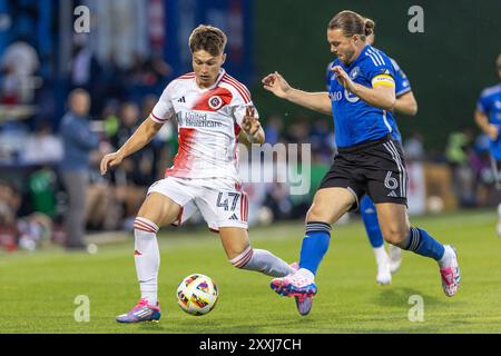 Montreal, Quebec, Canada. 24th Aug, 2024. ESMIR BAJRAKTAREVIC (#47), forward from Revolution fighting for ball with SAMUEL PIETTE (#6), defensive midfielder from CF Montreal in First half of their match at Saputo Stadium in Montreal, Quebec, Canada (Credit Image: © Yannick Legare/ZUMA Press Wire) EDITORIAL USAGE ONLY! Not for Commercial USAGE! Credit: ZUMA Press, Inc./Alamy Live News Stock Photo