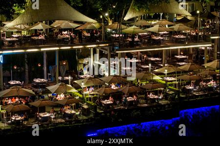 Chongqing. 23rd Aug, 2024. A drone photo taken on Aug. 23, 2024 shows tourists enjoying hotpot and the night view in a restaurant at the Nanshan scenic spot in Chongqing, southwest China. Renowned tourist destinations in Chongqing, a city known for its high temperatures, attract many tourists in summer. Credit: Liu Chan/Xinhua/Alamy Live News Stock Photo