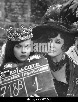 A candid photo of GENEVIEVE BUJOLD and  MICHELINE PRESLE on the set of LE ROI DE COEUR /  KING OF HEARTS 1966 Director PHILIPPE de BROCA Screenplay DANIEL BOULANGER from an idea by MAURICE BESSY Cinematography PIERRE LHOMME  Music GEORGES DELERUE Costume Design JACQUES FONTERAY Fildebroc / Les Productions Artistes Associes / Compagnia Cinematografica Montoro ?  United Artists/ Stock Photo