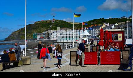 Aberystwyth coastal town in Ceredigion Wales UK, views of South beach, the Pier colourful shops and people Stock Photo