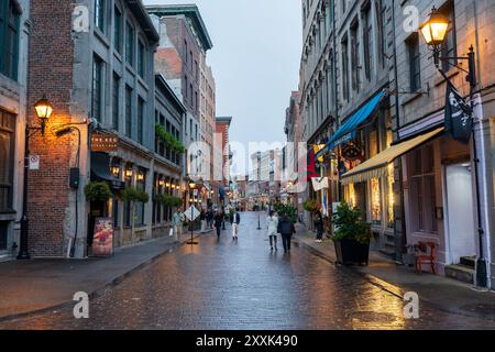 Montreal, Quebec, Canada - October 19 2022 : Street view of Old Montreal on a rainy evening. Saint Paul East Street (Rue Saint-Paul East). Stock Photo