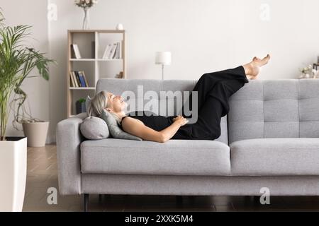 Woman taking moment to unwind and relax after long day Stock Photo