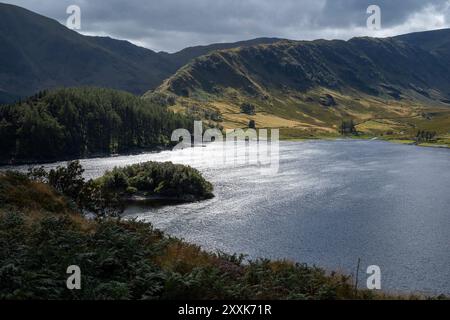 Haweswater reservoir below the steep-sided ridge leading to ' High Street' Fell, Westmorland & Furness, Cumbria, UK Stock Photo