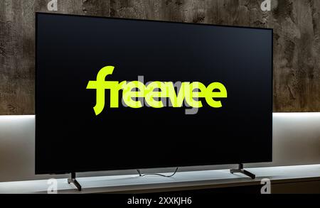 POZNAN, POL - JUL 31, 2024: Flat-screen TV set displaying logo of Amazon Freevee, an American ad-supported video-on-demand (VOD) streaming service own Stock Photo
