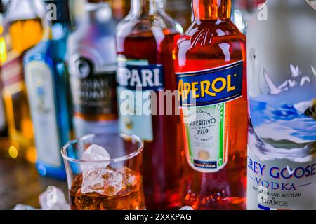 POZNAN, POL - NOV 29, 2023: Bottles of assorted global hard  liquor brands in a bar Stock Photo