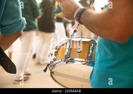 Street musician playing traditional human towers music in a parade. Catalan music instruments. Stock Photo