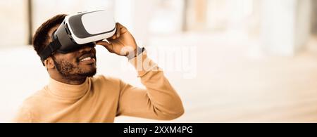 Afro manager wearing augmented reality goggles at office Stock Photo