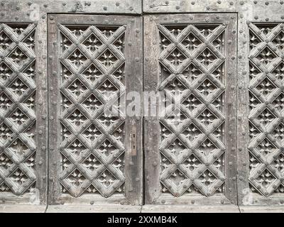 Old medieval decorated wooden door Stock Photo