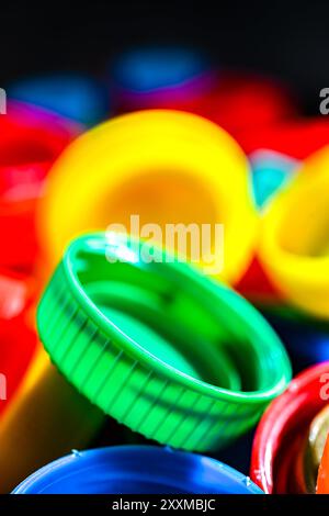 Different sorts of colorful plastic bottle caps. Recycling. Stock Photo