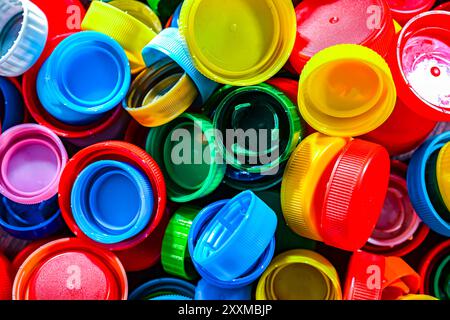 Different sorts of colorful plastic bottle caps. Recycling. Stock Photo