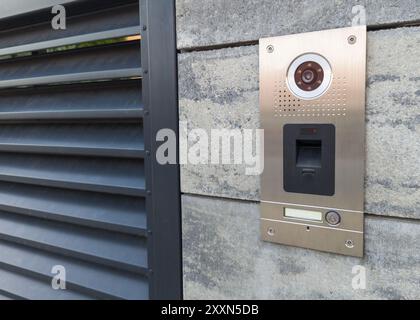 Stainless Steel Intercom on Concrete Wall Stock Photo