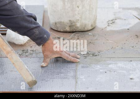 Mason was repaired for the floor tile Stock Photo
