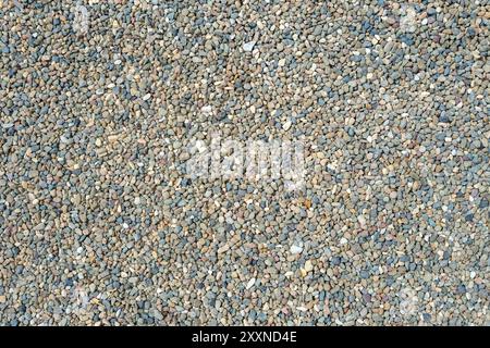 Screen-filling texture of fine gravel covering a footpath in a public park. Stock Photo
