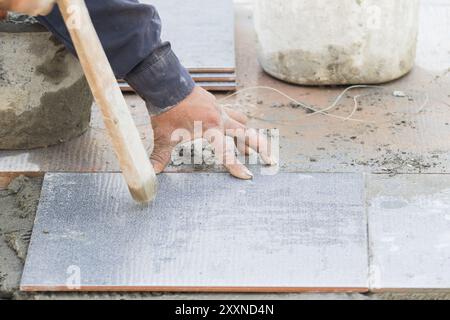 Mason was repaired for the floor tile Stock Photo