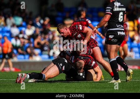 Wimbledon, UK. 25th Aug, 2024. Leigh Leopards make a tackle during the Betfred Super League Round 23 match London Broncos vs Leigh Leopards at Plough Lane, Wimbledon, United Kingdom, 25th August 2024 (Photo by Izzy Poles/News Images) in Wimbledon, United Kingdom on 8/25/2024. (Photo by Izzy Poles/News Images/Sipa USA) Credit: Sipa USA/Alamy Live News Stock Photo