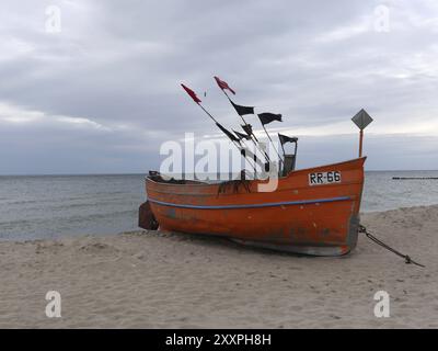 Fishing boat on the Baltic coast near Rewal in Poland Stock Photo