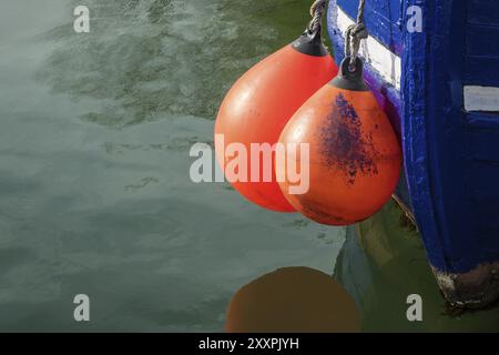 Fender on a fishing boat in the harbour Stock Photo