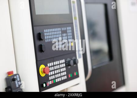 Close up of modern industrial CNC machine. Selective focus. Stock Photo