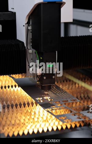 close up of sheet metal cutting process using CNC laser cutting machine Stock Photo