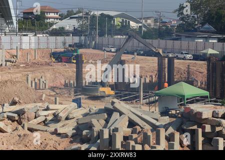 Construction work zones of piling where piles are driven into the ground for large construction projects with stable foundations. Stock Photo