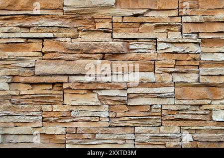 Stone cladding made of horizontal strips. External modern front wall. Background and texture. Trencin, Slovakia Stock Photo