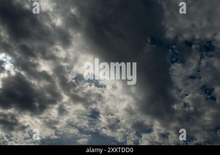 Storm clouds in the blue sky. Dramatic cloudy sky with gray clouds. Weather background. Dubnica, Slovakia Stock Photo