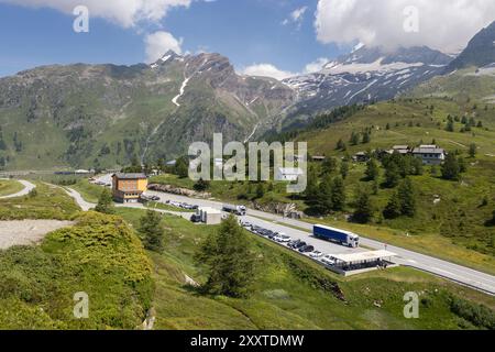 Sumer view of the famous Simplon Pass Road connecting Switzerland and Italy. With the tourist car park and a backdrop of beautiful mountains on a sunn Stock Photo