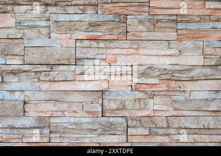 Stone cladding made of horizontal strips. External modern front wall. Background and texture. Trencin, Slovakia Stock Photo