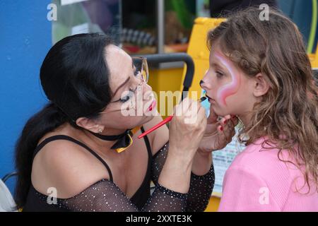 A face painting session at the Oz Land Festival in Peekskill, NY. Oz author L. Frank Baum was a temporary resident in there. Stock Photo