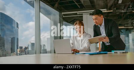 Engaging in a Collaborative Business Meeting within a Modern Office Environment Setting Stock Photo