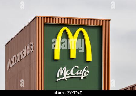 Deventer, The Netherlands - March 26, 2024: Exterior of a Dutch McDonald's McCafé coffee cafe in Deventer, The Netherlands Stock Photo