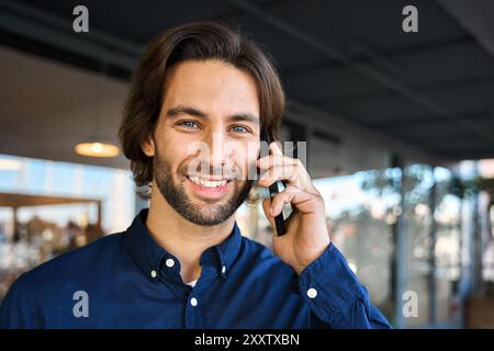 Happy young business man making call talking on the phone. Close up portrait Stock Photo