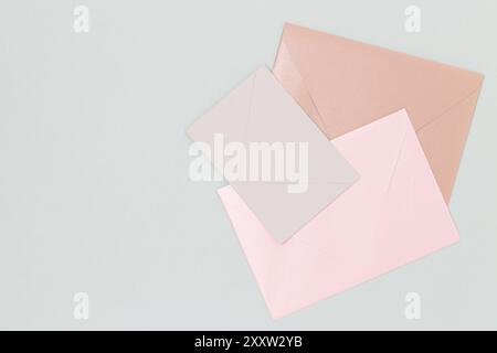 Multicolored envelopes on a blue background. Place for your design. Stock Photo