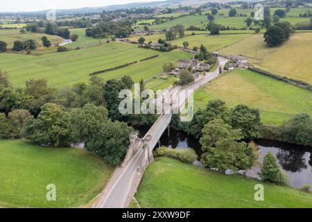 Aerial drone photo of the beautiful town of Middleham in Leyburn in North Yorkshire in the UK showing the British countryside and a famous historical Stock Photo