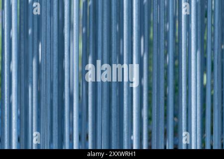 Metal fence. Vertical lines. Backgrounds and textures. Stock Photo
