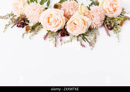 Autumn creative composition roses, asters coral flowers on white background. Fall, autumn wedding background. Flat lay, top view, copy space. Stock Photo