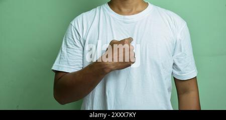 Man indicated on himself isolated on green brackground Stock Photo