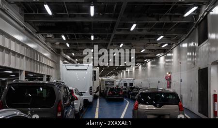 Fehmarn - Puttgarden, Germany, July 21, 2024 - Interior of the Puttgarden Rosby ferry with cars parked inside Stock Photo