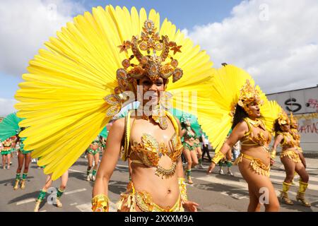 London, UK. 26th Aug, 2024. Performers participate in Notting Hill Carnival in London, Britain, on Aug. 26, 2024. Originated in the 1960s, the carnival is a way for Afro-Caribbean communities to celebrate their cultures and traditions. Credit: Xinhua/Alamy Live News Stock Photo