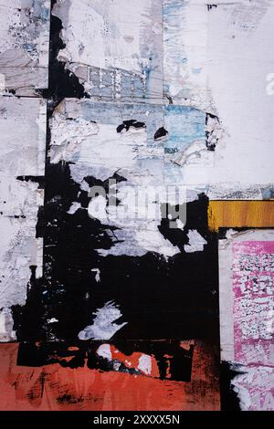 Wall with torn and pealing paper. Stock Photo