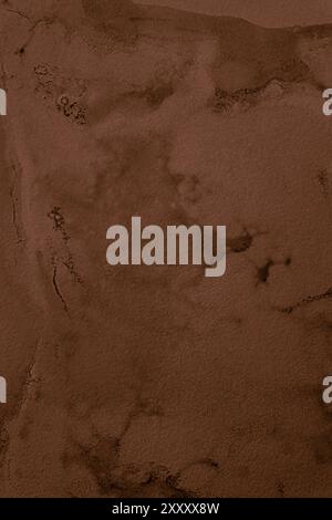 Dark brown, old, and rusted background made of water damaged plaster with abstract stains. Stock Photo