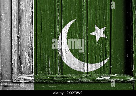 An image of the Pakistan flag painted on a brick wall in an urban ...