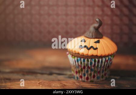 Halloween design homemade cupcake on dark background Stock Photo