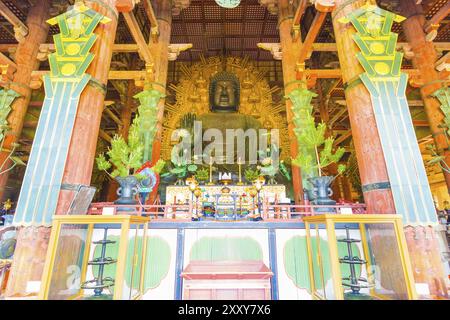 Front of the centered largest bronze Daibutsu statue and altar inside the Great Buddha Hall, Daibutsud-en, at Todai-ji temple in Nara, Japan. Horizont Stock Photo