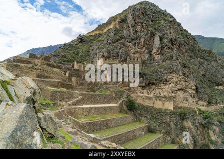 Inca ruins and the terraces of Pumatallis at Ollantaytambo in Peru Stock Photo