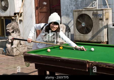 Playing pool in a small street in Nanjing, China. Stock Photo