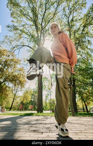 Young Woman Enjoying Outdoor Activities in Sunny Park Stock Photo